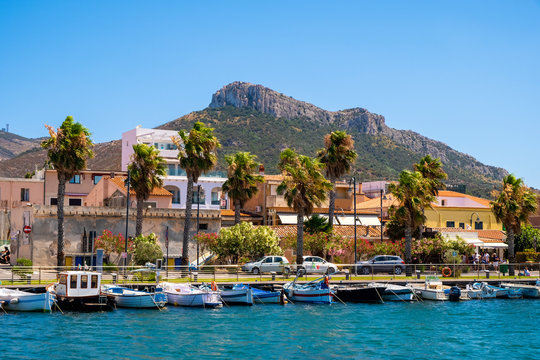 Golfo Aranci, Sardinia, Italy - Panoramic view of Golfo Aranci yacht port - Marina di Golfo Aranci - with seashore park boulevard at the Tyrrhenian Sea coast