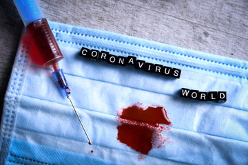 Coronavirus blood analysis concept.Covid 19 originating in Wuhan, China.respiratory mask with a...