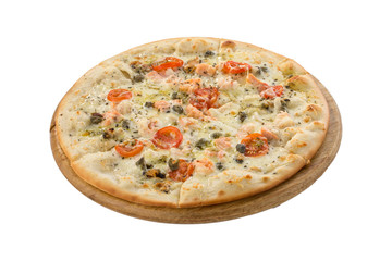 Delicious seafood pizza with salmon, capers and tomatoes on wooden board isolated on white background
