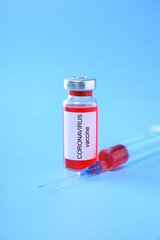 Coronavirus vaccine shot Covid 19 for baby vaccination on blue background, medicine and drug concept