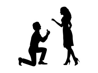 Silhouette of man standing on knee makes an offer to marry woman