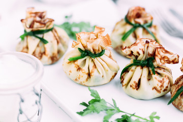 Pancakes with mushroom filling with sour cream