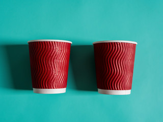 Eco-friendly degradable disposable cups on a blue background