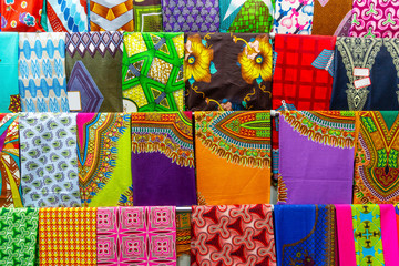 Plenty of colorful African fabrics in a rows