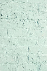 Aged aqua menthe color brick wall textured background for your design, closeup, copy space, vertical