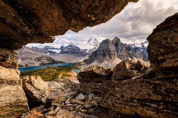  Frame of rocky with mount Assiniboine on Nublet peak at provincial park © Mumemories