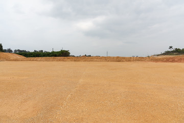 Perspective view of open and level dirt ground