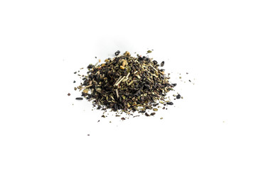 different sorts of black or green tea in bulk  on a white background close-up isolated