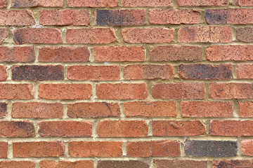 retro red brick sand grout garden wall close-up
