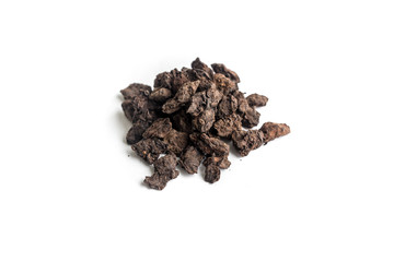 different sorts of black or green tea in bulk  on a white background close-up isolated