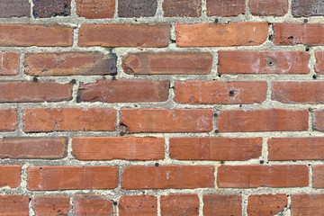 vintage old red brick wall holes close-up