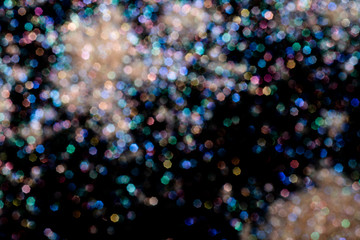 bokeh multicolored glitter lights background colorful lens effect, copy space.