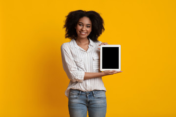 Happy Afro Girl Holding Digital Tablet With Empty Black Screen