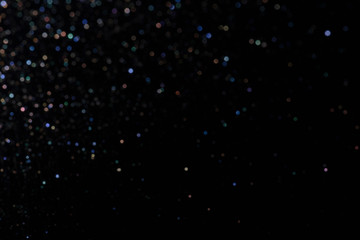 bokeh multicolored glitter lights background colorful lens effect, copy space.