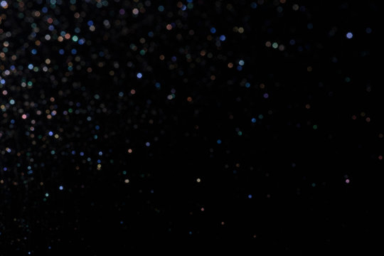 bokeh multicolored glitter lights background colorful lens effect, copy space.