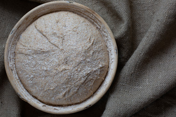 Proofing dough in a special basket. Raise the dough before baking. Yeast-free dough. The fermentation process of the dough.