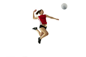 Fototapeta na wymiar In jump and flight. Young female volleyball player isolated on white studio background. Woman in sportswear and sneakers training, playing. Concept of sport, healthy lifestyle, motion and movement.