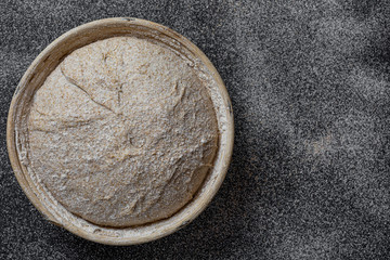 Proofing dough in a special basket. Raise the dough before baking. Yeast-free dough. The fermentation process of the dough.