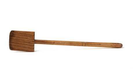old used wooden kitchen spatula for stirring dishes isolated on white background