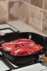 Raw beef steak in grill pan