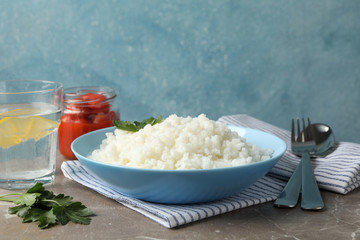 Composition with delicious rice on grey background, space for text