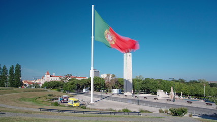 Big Portuguese flag on top of the Eduardo VII Park in Lisbon Portugal timelapse