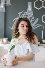 Portrait of a beautiful girl. Romantic shot. Young pretty happy woman in a dress.  Fashion style photo of a smiling girl