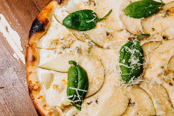Delicious pizza with pear and blue cheese.