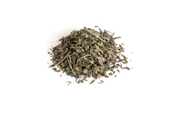 different sorts of black or green tea in bulk  on a white background close-up isolated