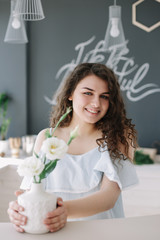 Portrait of a beautiful girl. Romantic shot. Young pretty happy woman in a dress.  Fashion style photo of a smiling girl