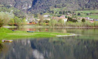 Obraz premium Lake in northern Italy, LAKE OF IDRO, border between lombardia and trentino, stunning view of lake in spring time