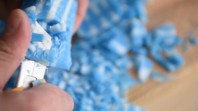 blue and white soap cuts with a knife
