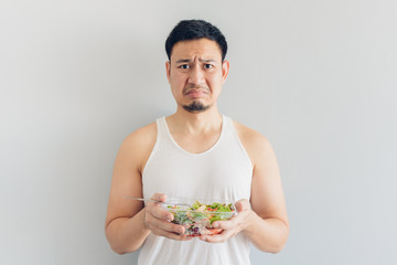 Man hates healthy salad meal.