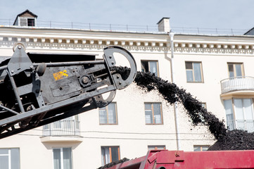 Traffic surface improvement By paving asphalt.Road repair in the city. Truck