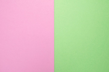 Pink and green pastel paper geometric layout.