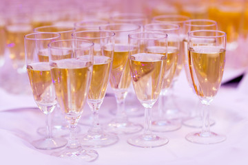 lot of glasses with champagne during on the party table