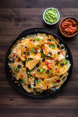 Flatlay view of Nachos on a baking sheet fresh out of the oven ready for eating.