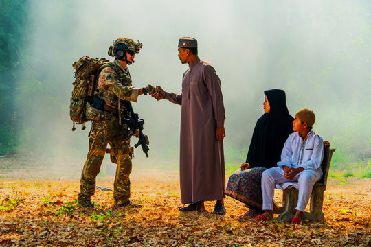 Soldier man with Muslims family.Soldiers shaking hands with Muslims people in Thailand. relationships  Thai people.