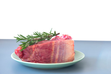 Raw beef fillet steaks with herbs and spices