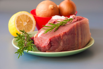 Raw beef fillet steaks with herbs and spices