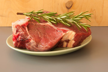 Raw beef fillet steaks with herbs and spices