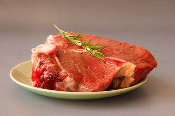 Raw beef fillet steaks with herbs and spices