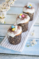Traditional Easter sweet bread decorated with sugar glaze and candy cane shape eggs