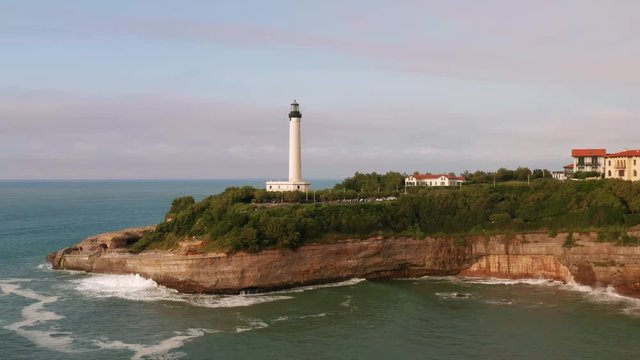 Phare de Biarritz. Drone flight flying towards lighthouse. Atlantic Ocean, Cape Hainsart, Biarritz, France.