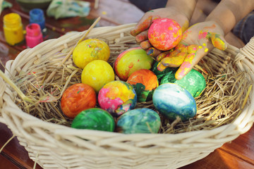 Children are having fun coloring the eggs for Easter.