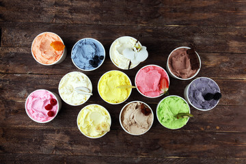 Various of ice cream flavor whit fresh blueberry, strawberry, kiwi, lemon, vanilla setup on rustic background . Summer and Sweet cold ice cream