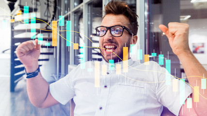 Excited Young Male of Trader Have Successful Day at the Stock Exchange Office. Dealer or Broker Buy and Sell Stock on the Market, Celebrate Profitable Transaction. Technical price graph and indicator