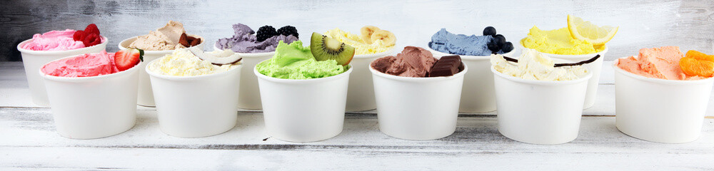 Various of ice cream flavor whit fresh blueberry, strawberry, kiwi, lemon, vanilla setup on rustic background . Summer and Sweet cold ice cream