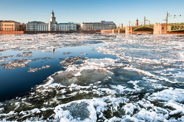 Neva river with ice in Saint Petersburg, Russia. View of the Palace Bridge