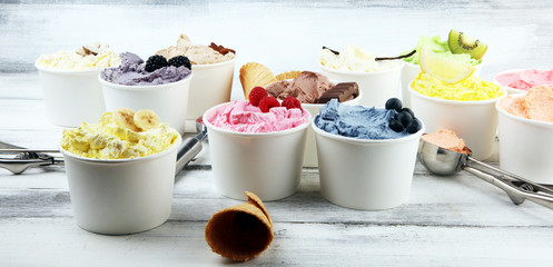 Various of ice cream flavor whit fresh blueberry, strawberry, kiwi, lemon, vanilla setup on rustic...